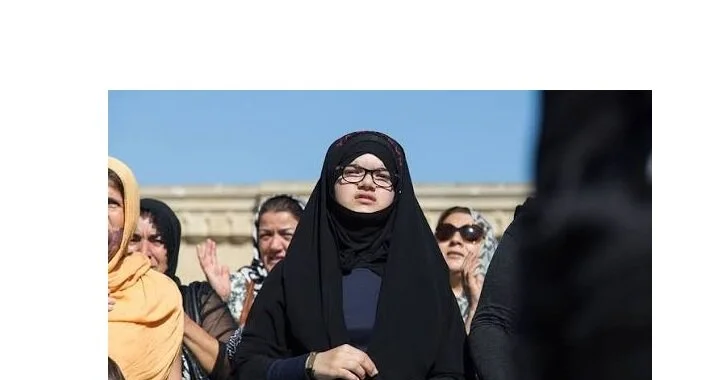 Azerbaijan police officer blocks hijab-wearing girls from entering school