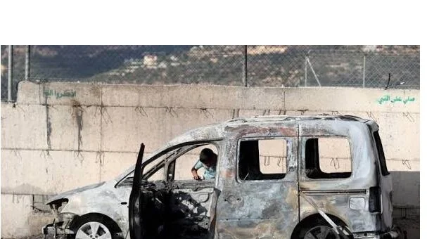 Israeli settlers set Palestinian vehicles on fire near al-Samu